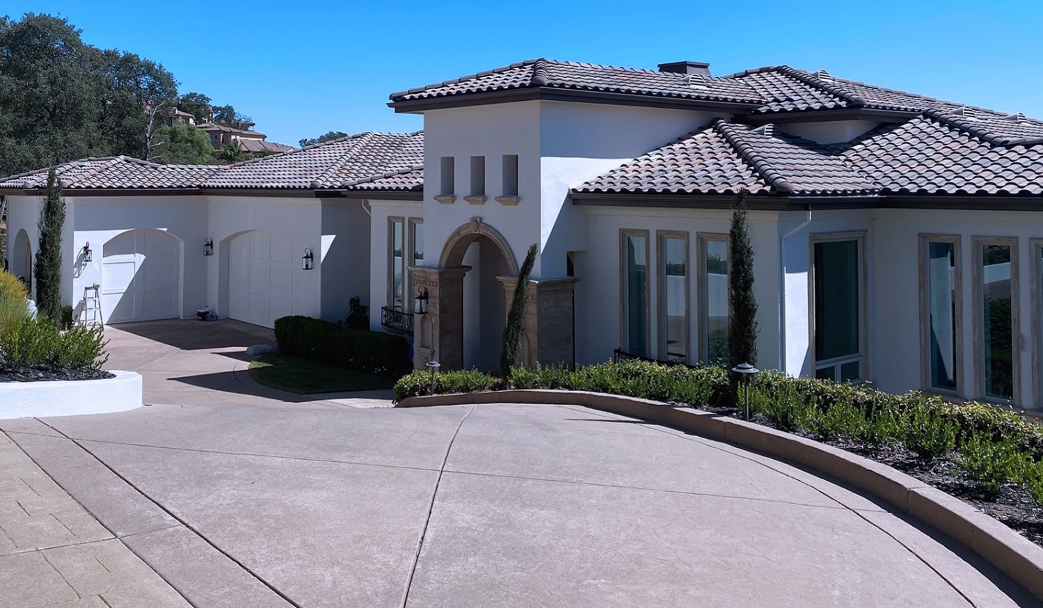 White spanish style home with tile roof